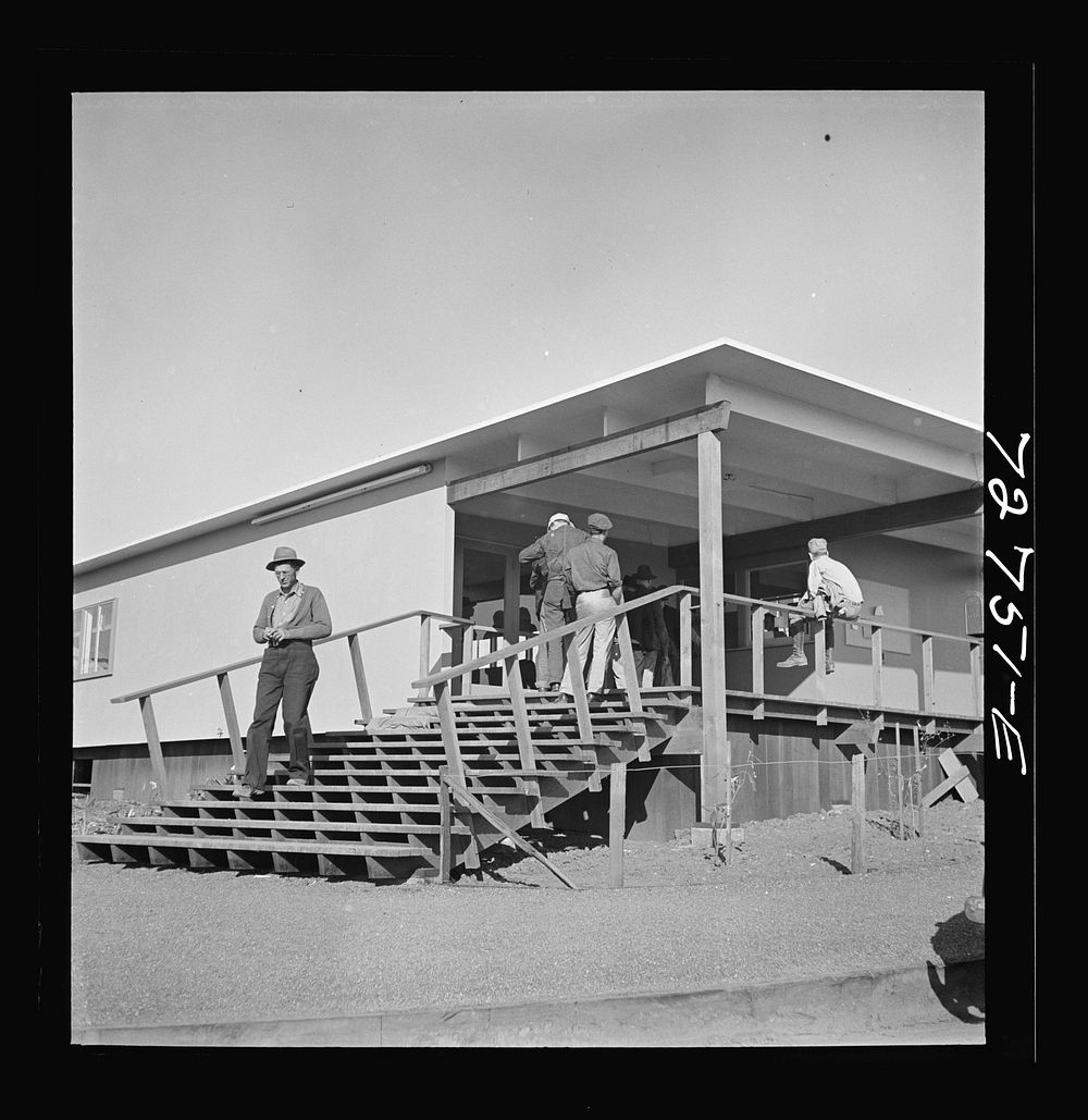 Vallejo, California. Workmen from shipyards at office of the FSA (Farm Security Administration) dormitories by Russell Lee
