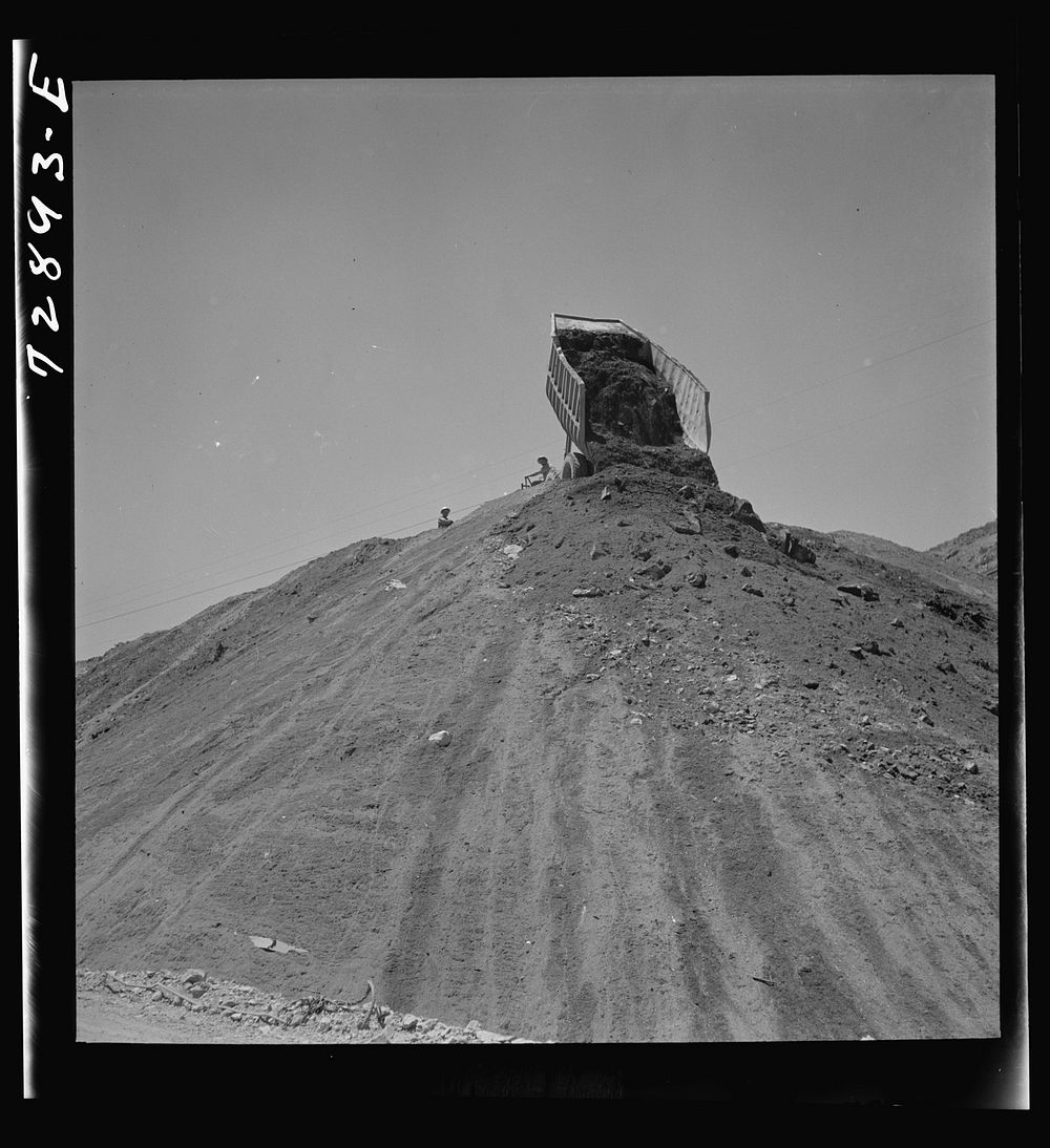 [Untitled photo, possibly related to: Shasta Dam, Shasta County, California. Dumping load of dirt which has been excavated…