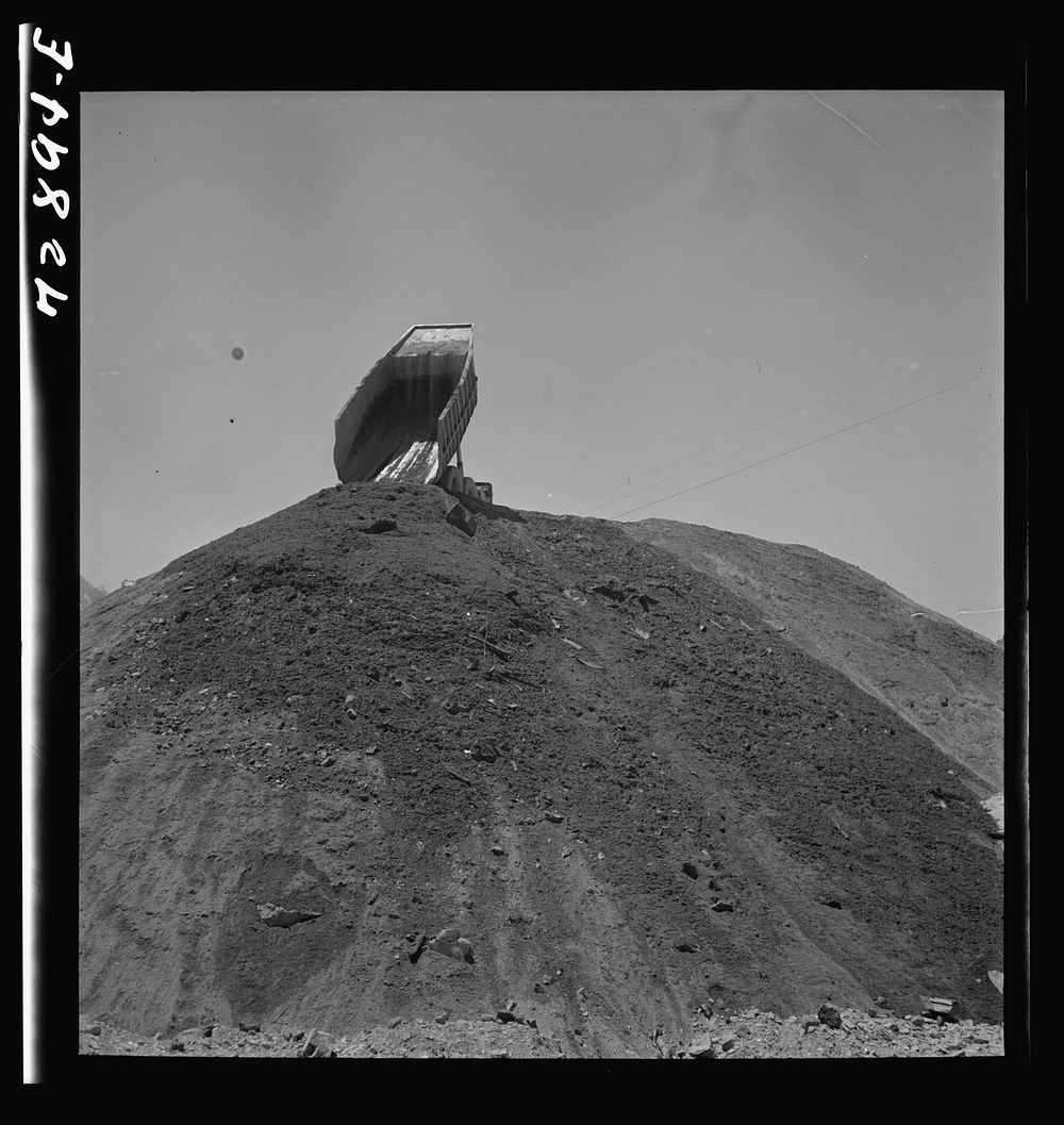 [Untitled photo, possibly related to: Shasta Dam, Shasta County, California. Dumping load of dirt which has been excavated…