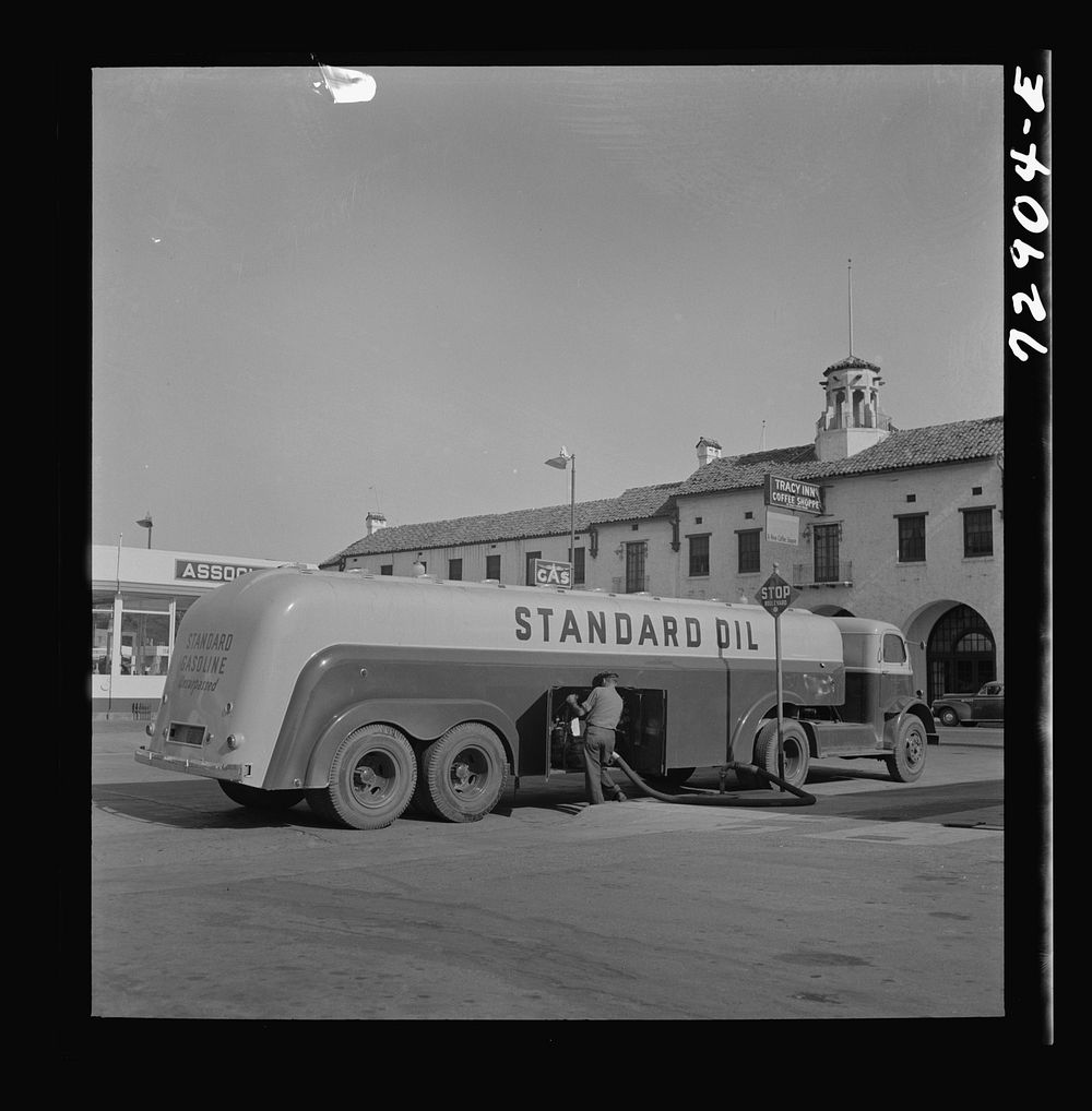 Tracy, California. A gasoline tank truck delivering gasoline to a filling station by Russell Lee