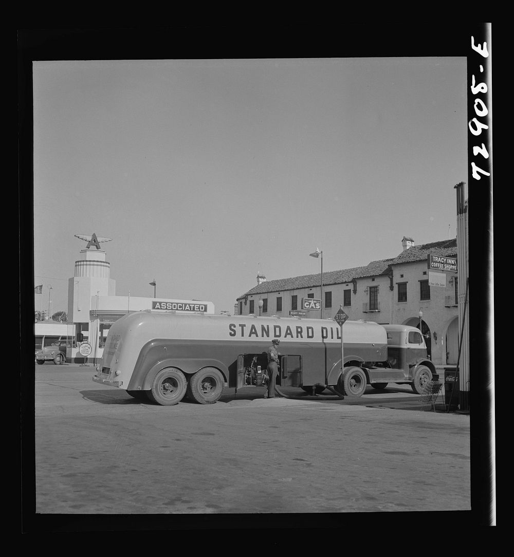 [Untitled photo, possibly related to: Tracy, California. A gasoline tank truck delivering gasoline to a filling station] by…