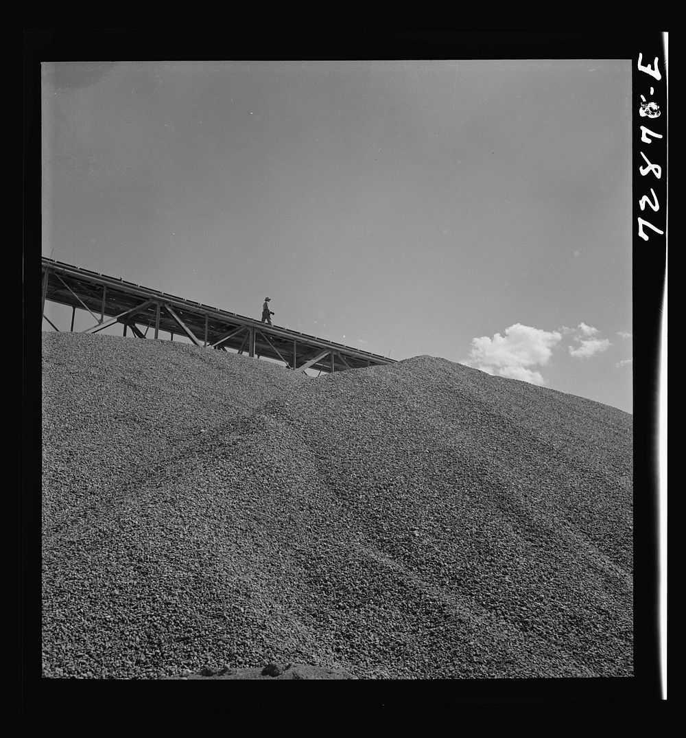 Shasta Dam, Shasta County, California. Sand and gravel are transported to construction site by Russell Lee