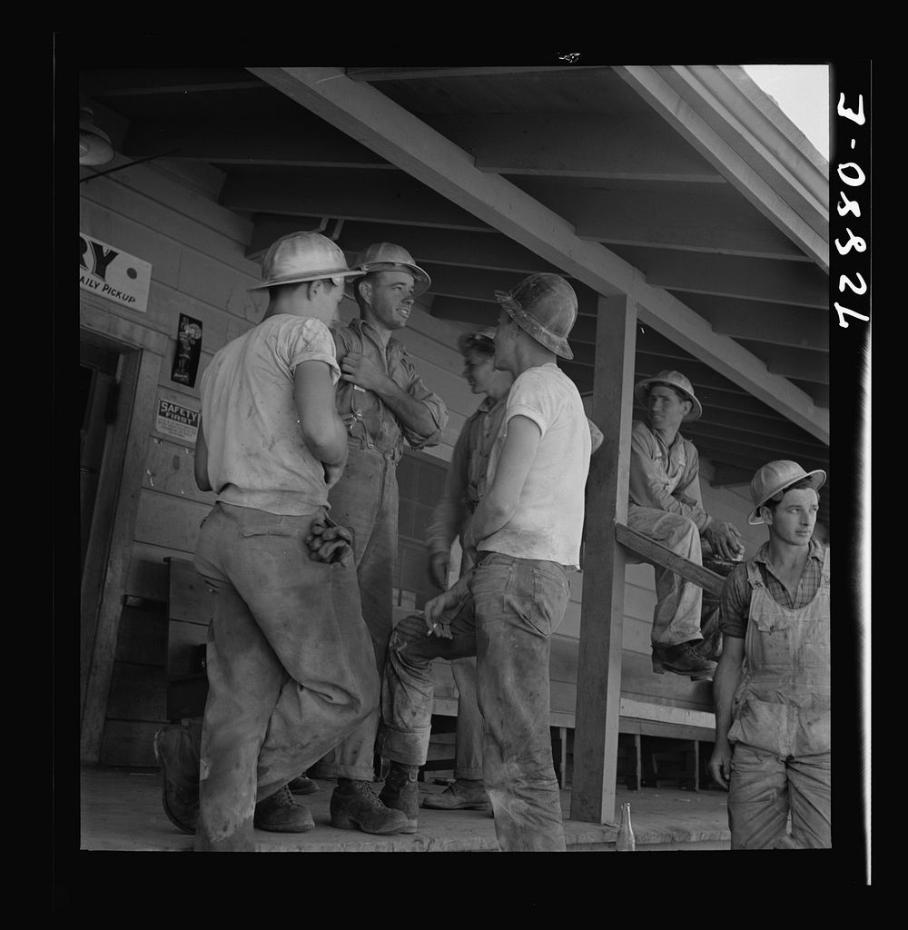 [Untitled photo, possibly related to: Shasta Dam, Shasta County, California. Workman on the porch of the commissary] by…