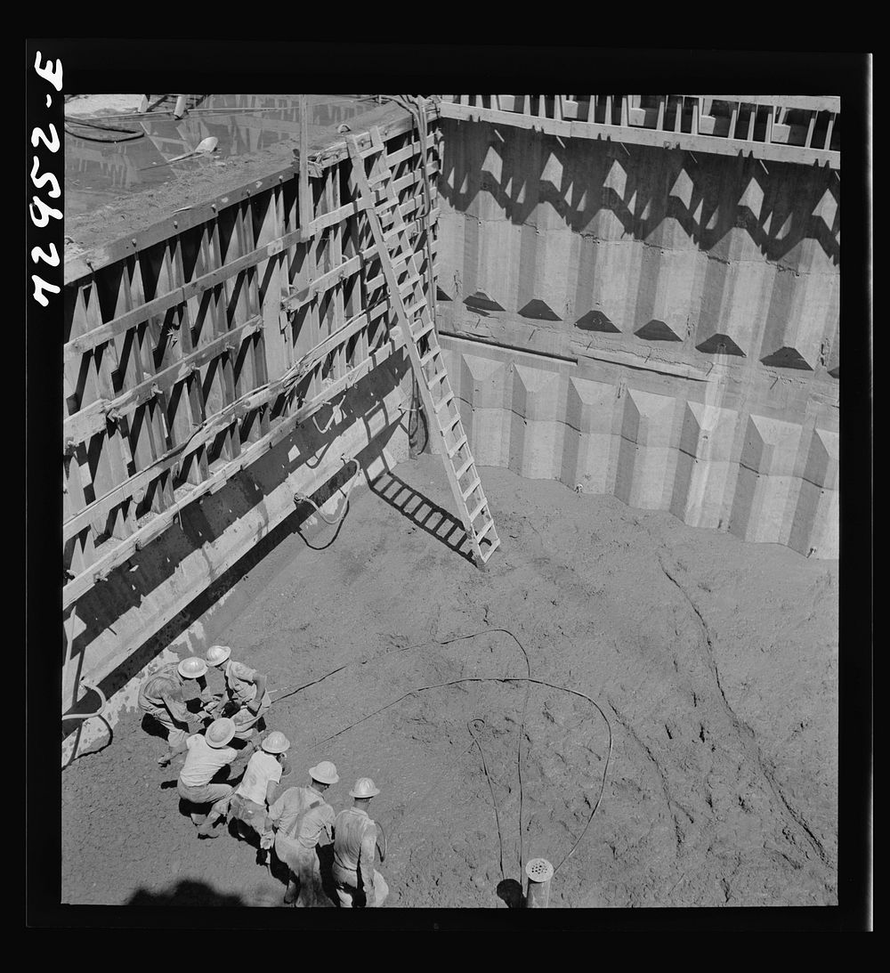 Shasta Dam, Shasta County, California. Vibrating newly-poured concrete at the dam to remove excess air and assure even…