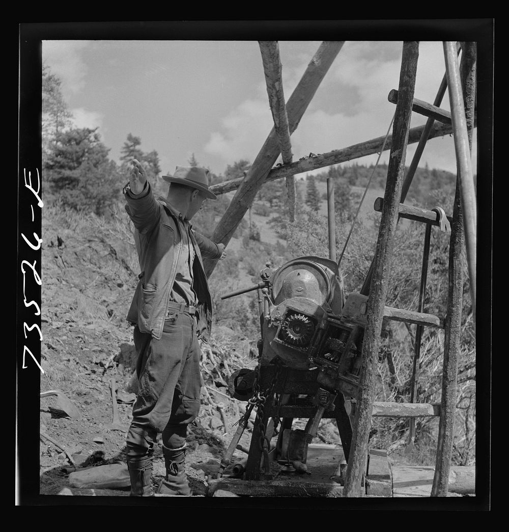Grant County, Oregon. Bureau of Mines representative taking bearing on angle of diamond drilling for chrome ore deposits by…