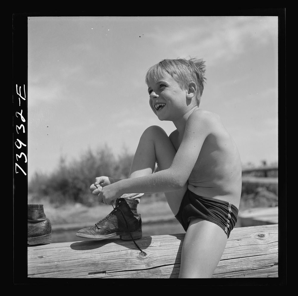 Rupert, Idaho. Schoolboy at swimming pool by Russell Lee
