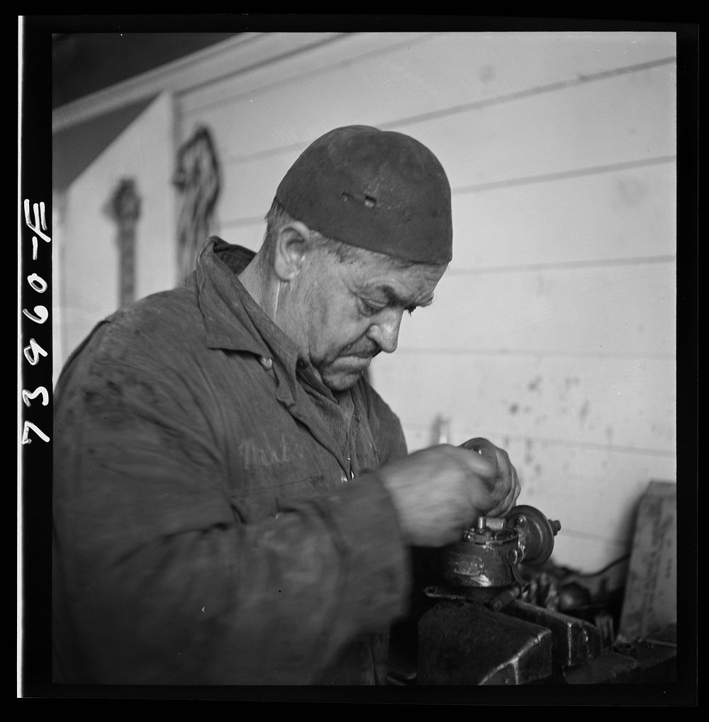 [Untitled photo, possibly related to: Burley, Idaho. Mechanic in garage] by Russell Lee