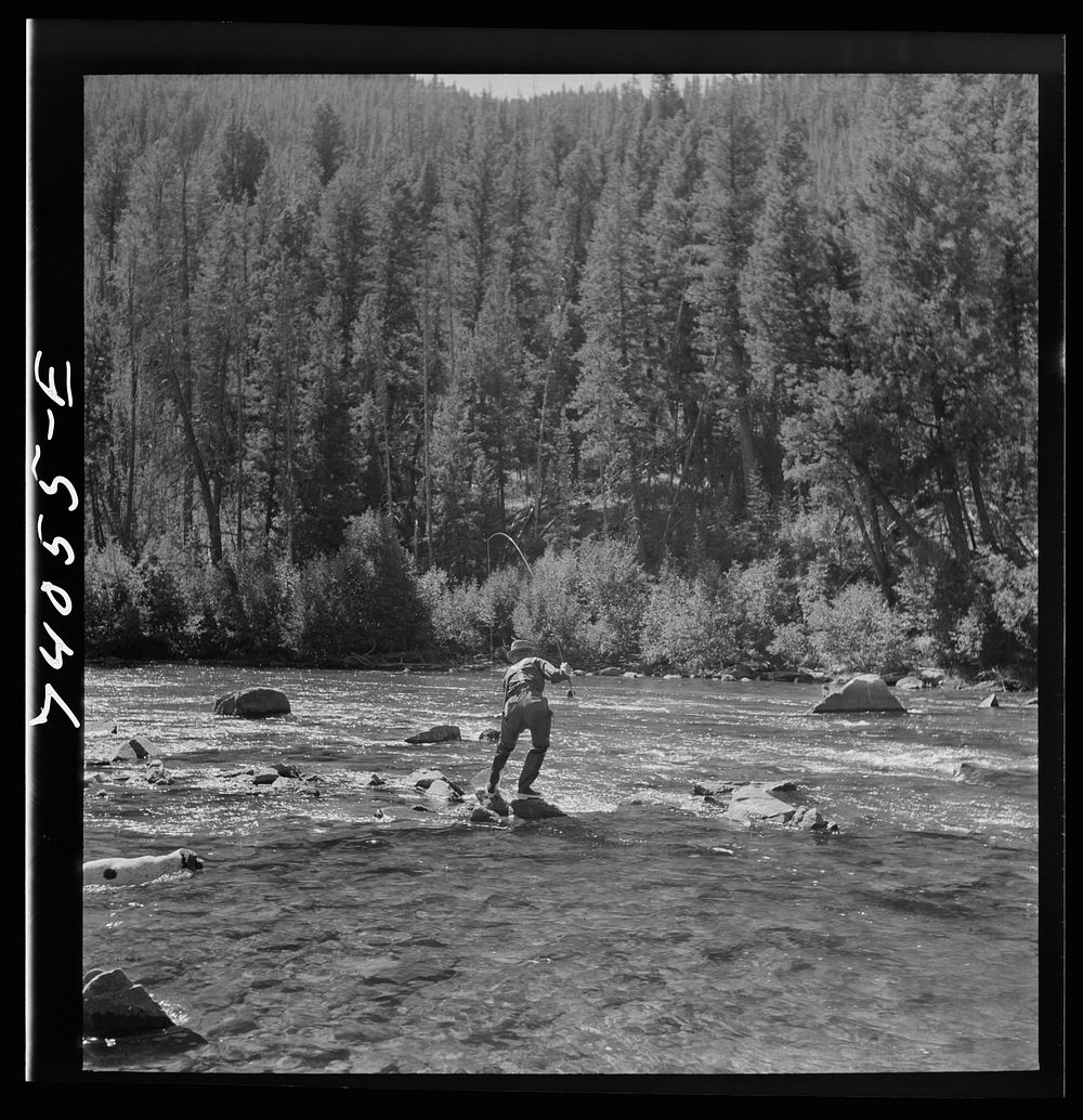 Custer County, Idaho. Fishing in the Salmon River by Russell Lee