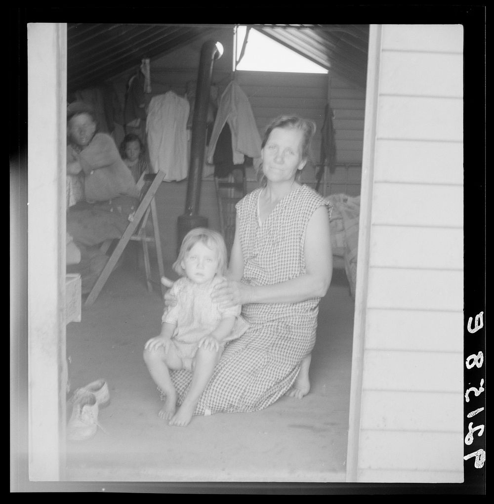 [Untitled photo, possibly related to: Tulare County, Farm Security Administration (FSA) camp. Migrant mother and child at…