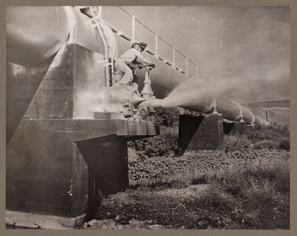 Owyhee Reclamation Project, Ore. Opening the gate valve of the Malheur siphon. Sourced from the Library of Congress.