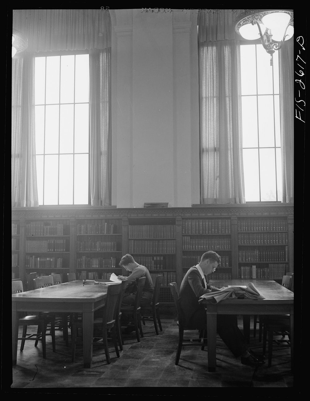 In the library at Iowa State College. Ames, Iowa. Sourced from the Library of Congress.