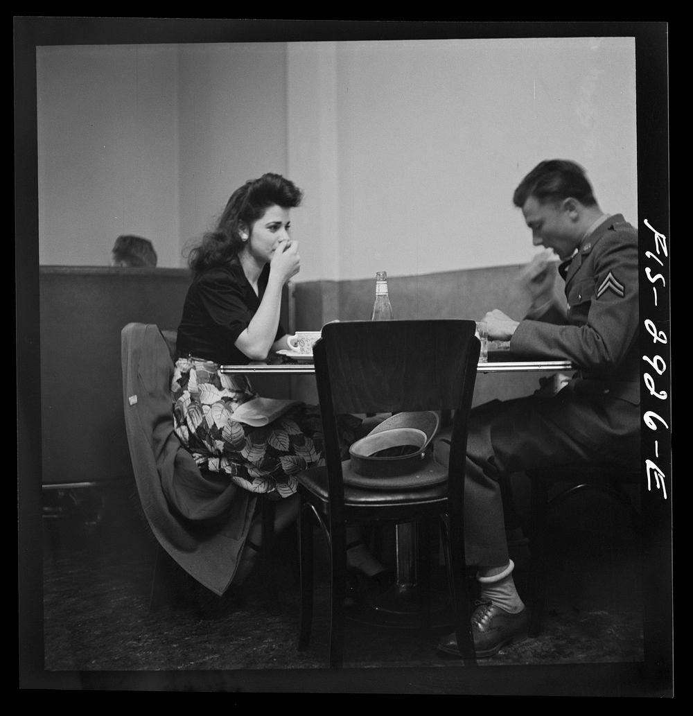 A corporal in the Army takes his girl to dinner. Bakersfield, California by Russell Lee