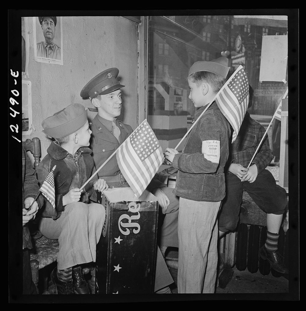 Chicago (north), Illinois. Junior Rangers talking things over with Private W.J. Miller. They all took part in a flag…