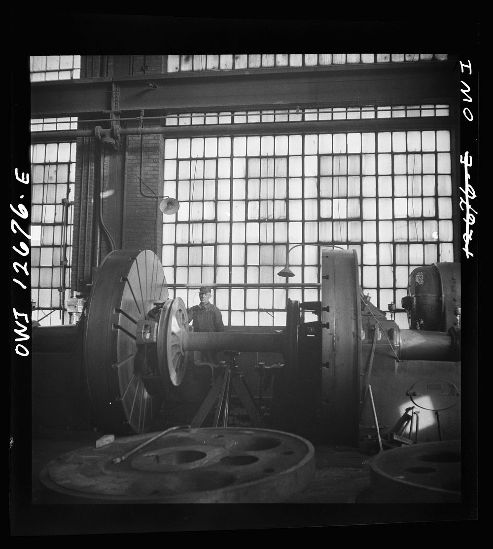 Chicago, Illinois. Refacing a wheel in the Chicago and Northwestern Railroad wheel shop. Sourced from the Library of…