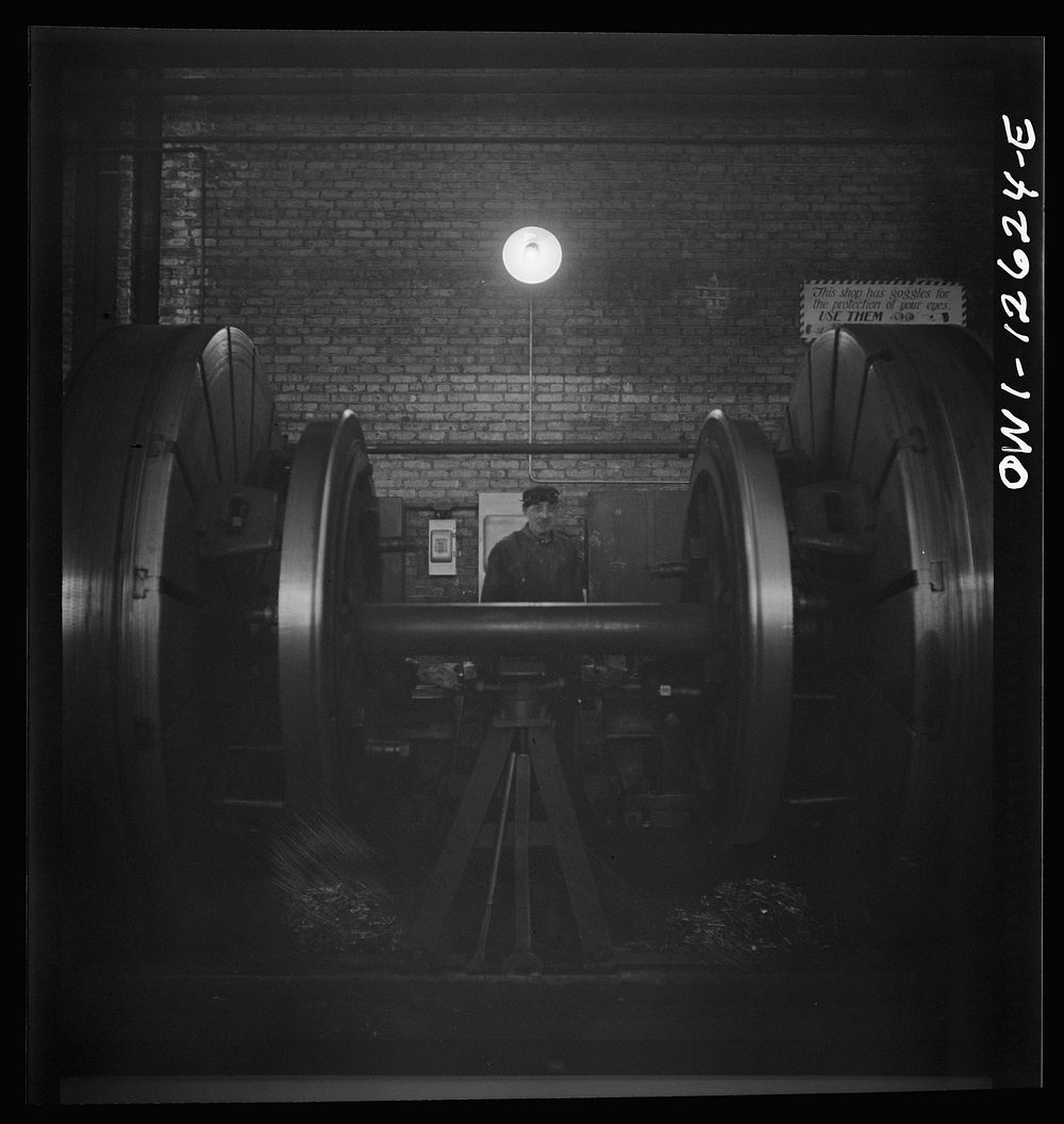 [Untitled photo, possibly related to: Chicago, Illinois. Refacing tires on locomotive's wheels at a Chicago and Northwestern…