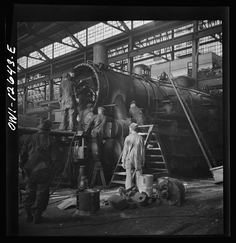 Chicago, Illinois. Working on a locomotive at the Chicago and Northwestern Railroad repair shop. Sourced from the Library of…