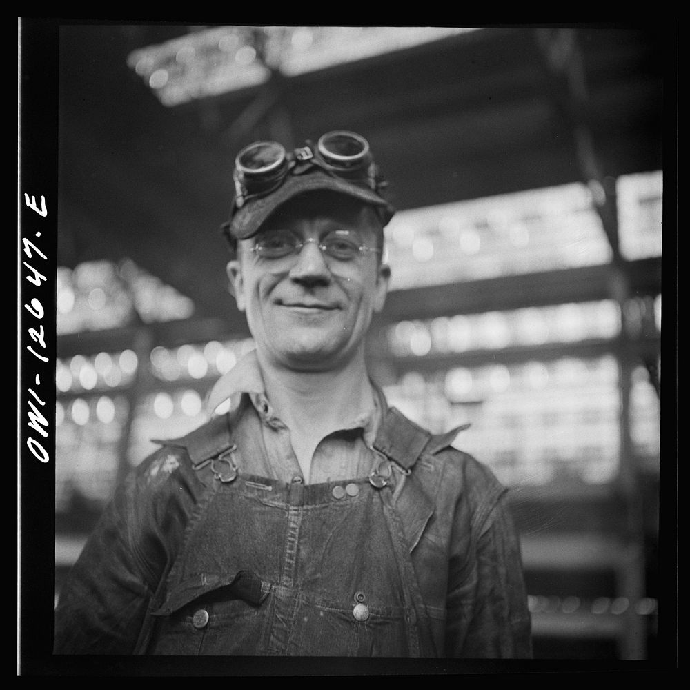 [Untitled photo, possibly related to: Chicago, Illinois. A worker in the Chicago and Northwestern Railroad locomotive repair…