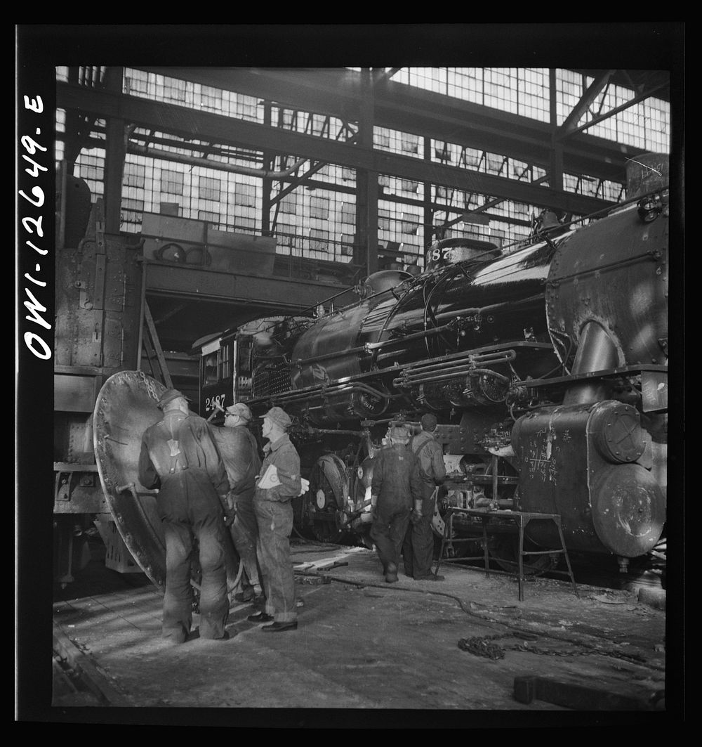 Chicago, Illinois. Working on a locomotive at the Chicago and Northwestern Railroad. Sourced from the Library of Congress.