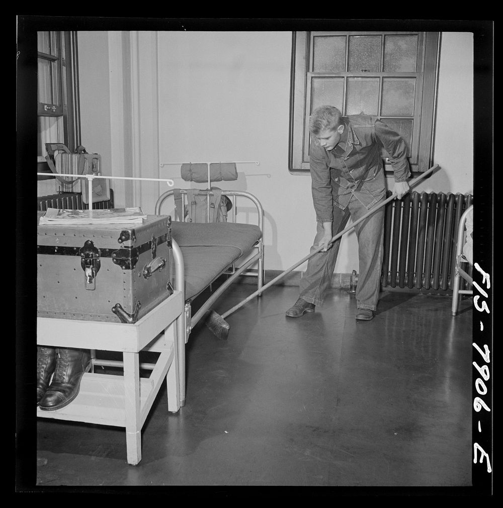 Fort Belvoir, Virginia. Sergeant George Camblair on fatigue duty in his barracks. Sourced from the Library of Congress.