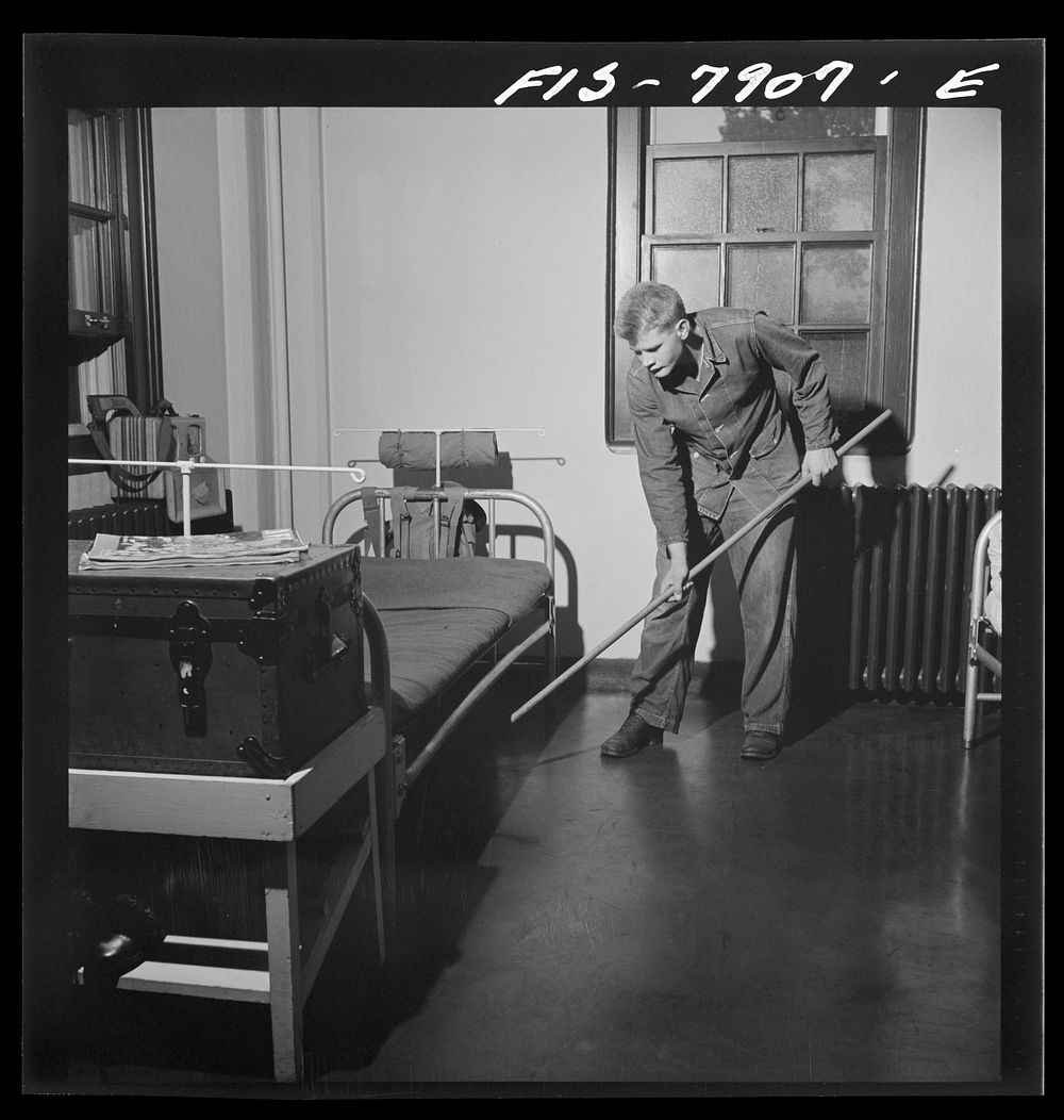 [Untitled photo, possibly related to: Fort Belvoir, Virginia. Sergeant George Camblair on fatigue duty in his barracks].…