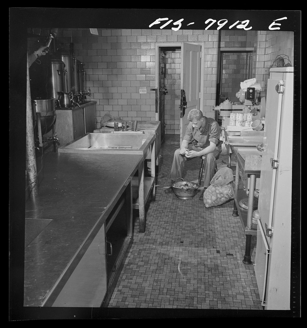 Fort Belvoir, Virginia. Sergeant George Camblair on kitchen police duty. Sourced from the Library of Congress.