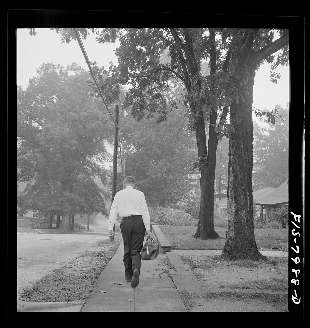 Washington, D.C. George Camblair leaving home early in the morning to go to the Selective Service Board from which, with…