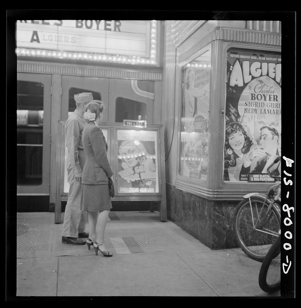 [Untitled photo, possibly related to: Washington, D.C. Sergeant George Camblair taking his girlfriend to the movies while he…