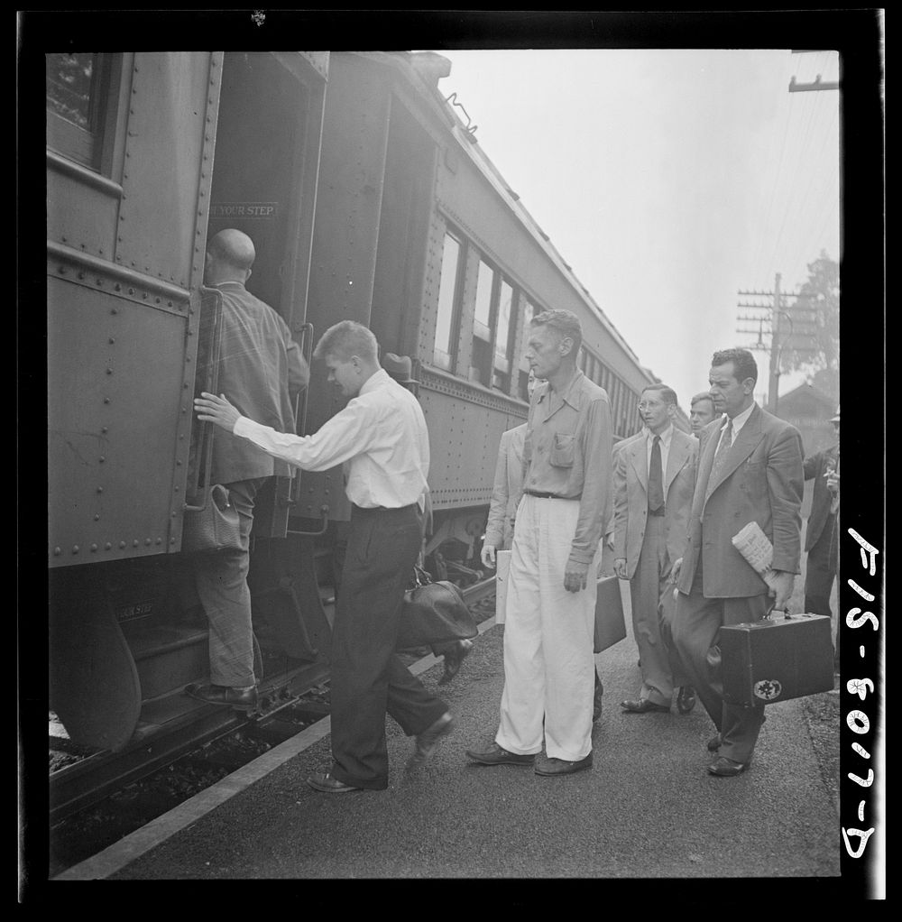 Silver Spring, Maryland. George Camblair waiting at the station for the train which will take him to the induction center.…