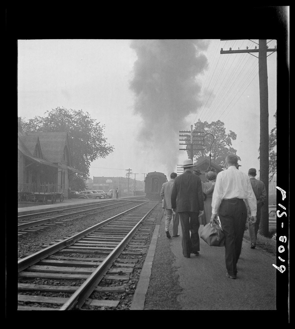 [Untitled photo, possibly related to: Silver Spring, Maryland. George Camblair waiting at the station for the train which…