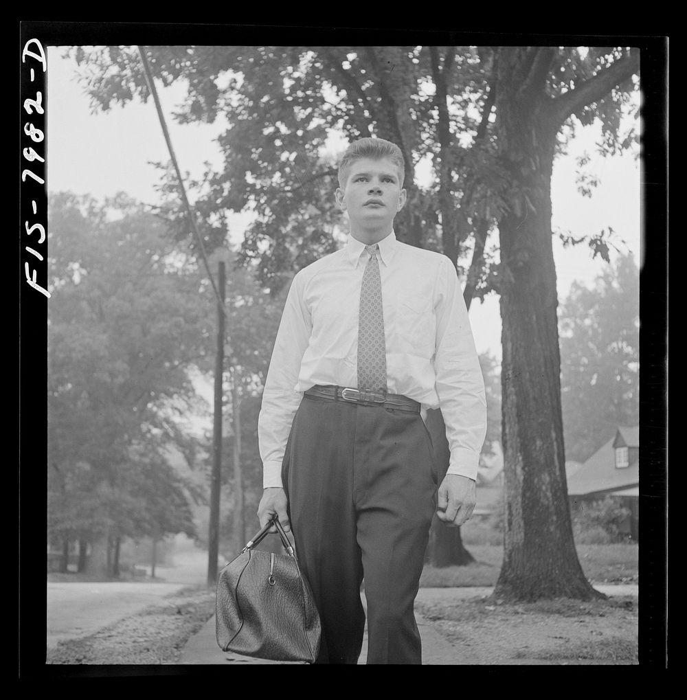Washington, D.C. George Camblair leaving home early in the morning to go to the Selective Service Board from which, with…