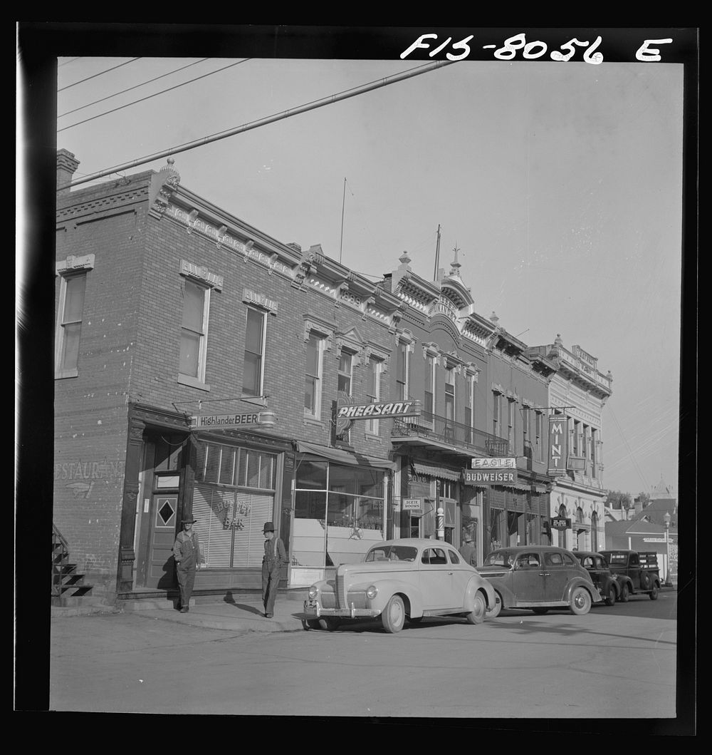 Dillon, Montana. Street corner. Dillon is the trading center for a prosperous cattle and sheep country by Russell Lee