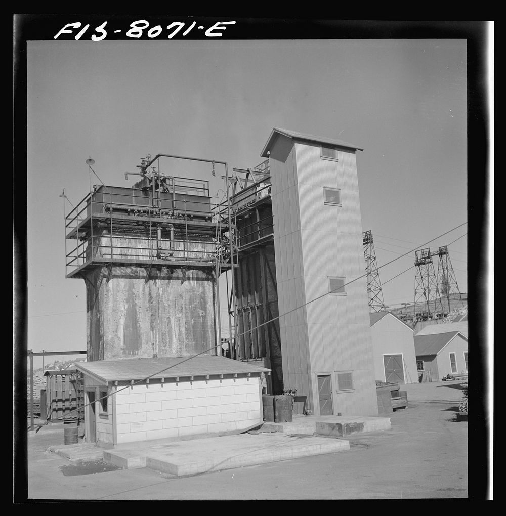 Butte, Montana. Anaconda Copper Mining Company. Refrigerating plant for cooling air at mountain con mine by Russell Lee