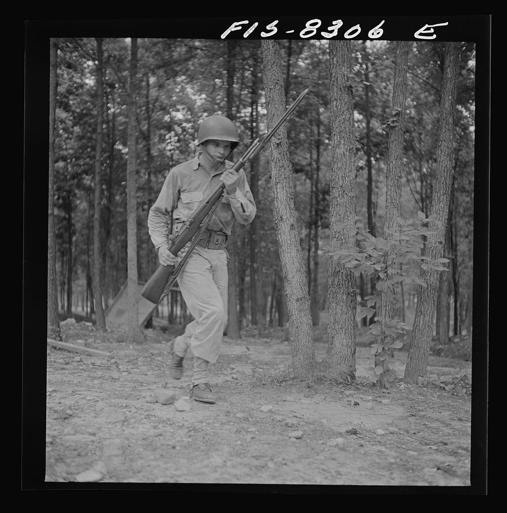 [Untitled photo, possibly related to: Fort Belvoir, Virginia. Sergeant George Camblair learning to use the bayonet]. Sourced…
