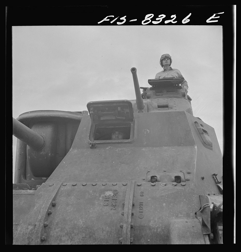 Fort Belvoir, Virginia. Sergeant George Camblair learning the operation of a tank. Sourced from the Library of Congress.