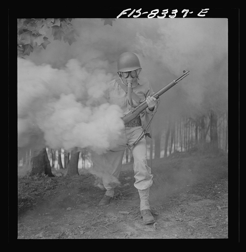 Fort Belvoir, Virginia. Sergeant George Camblair learning how to use a gas mask in a practice smokescreen. Sourced from the…