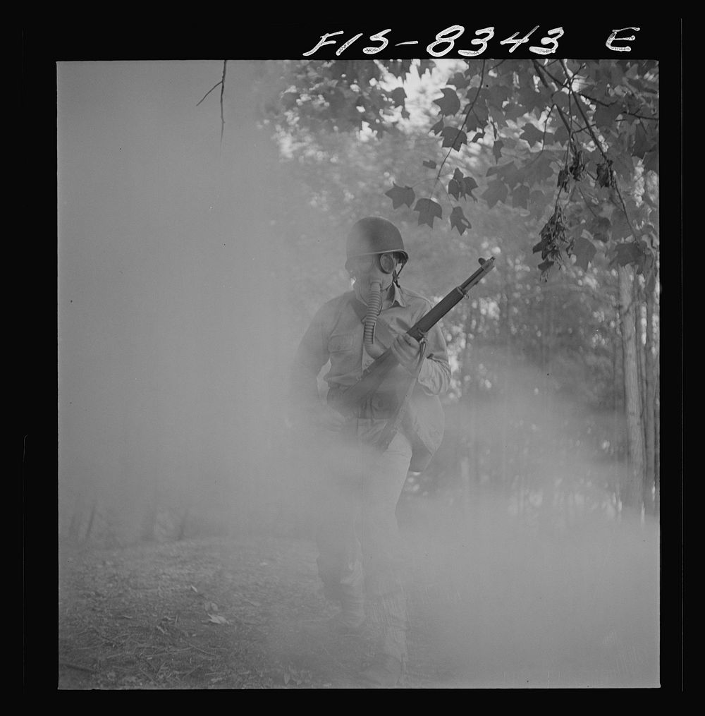[Untitled photo, possibly related to: Fort Belvoir, Virginia. Sergeant George Camblair learning how to use a gas mask in a…