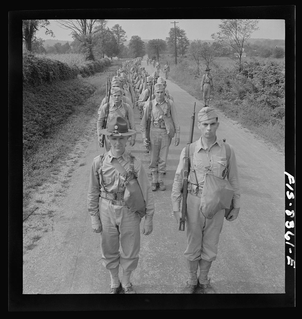 Fort Belvoir, Virginia (vicinity). Sergeant George Camblair on a march along the road near camp. Sourced from the Library of…