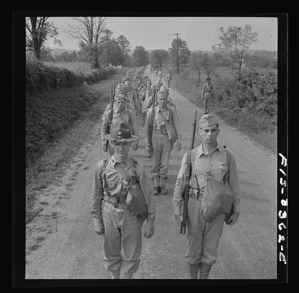 [Untitled photo, possibly related to: Fort Belvoir, Virginia (vicinity). Sergeant George Camblair on a march along the road…