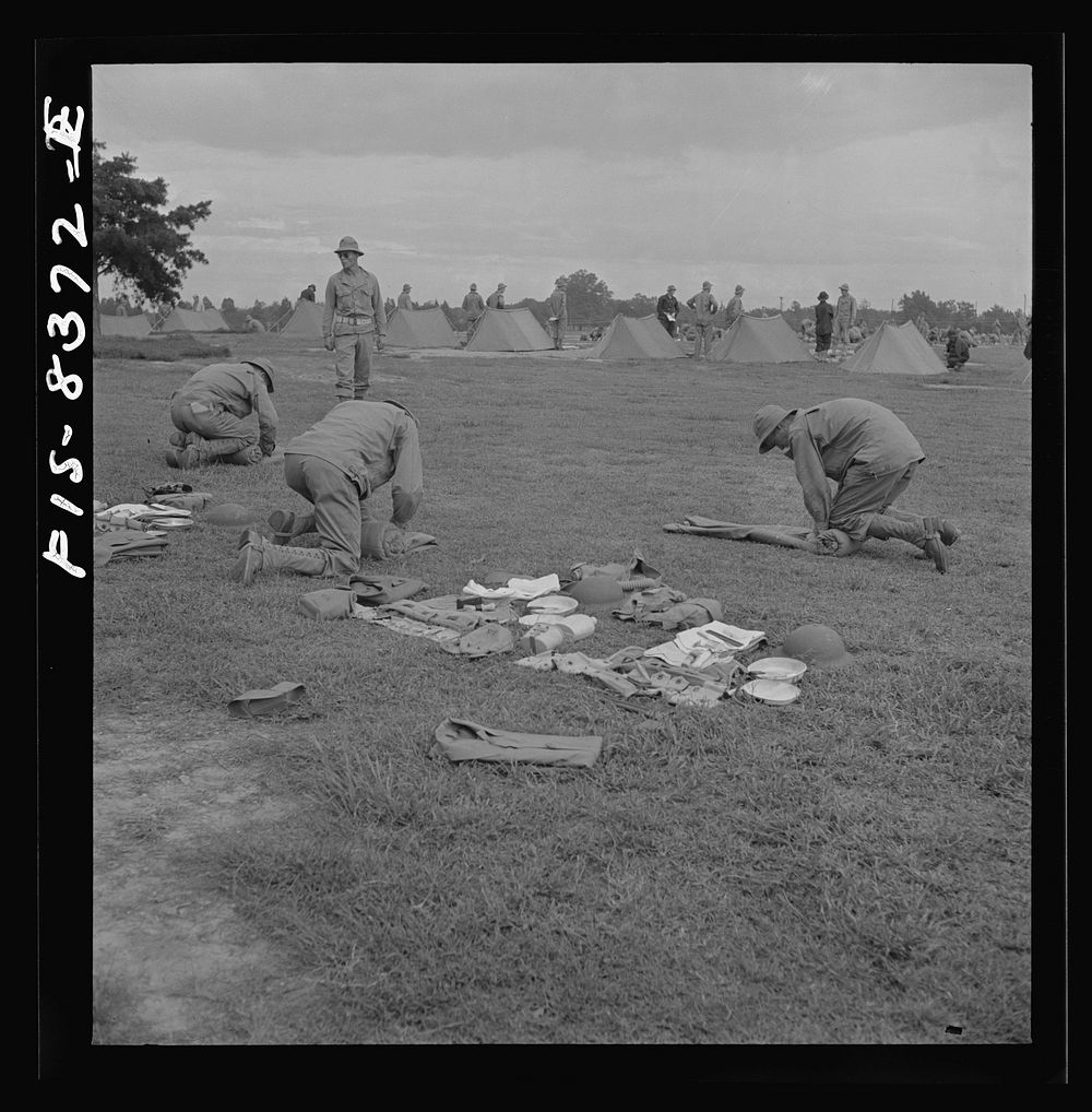 [Untitled photo, possibly related to: Fort Belvoir, Virginia. Sergeant George Camblair learning how to make up his pack].…