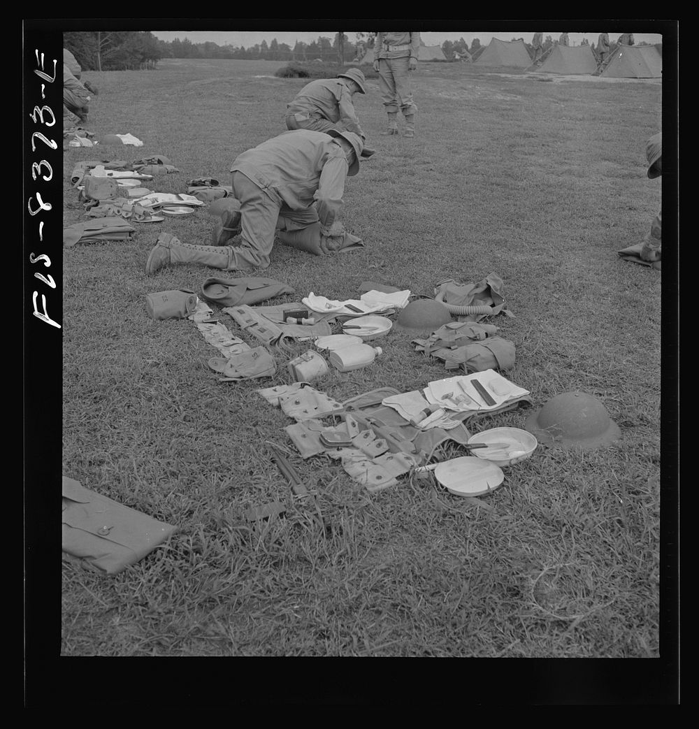 Fort Belvoir, Virginia. Sergeant George Camblair learning how to make up his pack. Sourced from the Library of Congress.