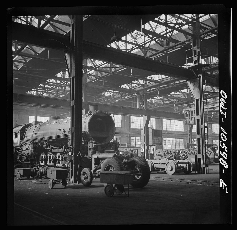 Chicago, Illinois. Locomotives in for repair at the roundhouse at an Illinois railroad yard. Sourced from the Library of…