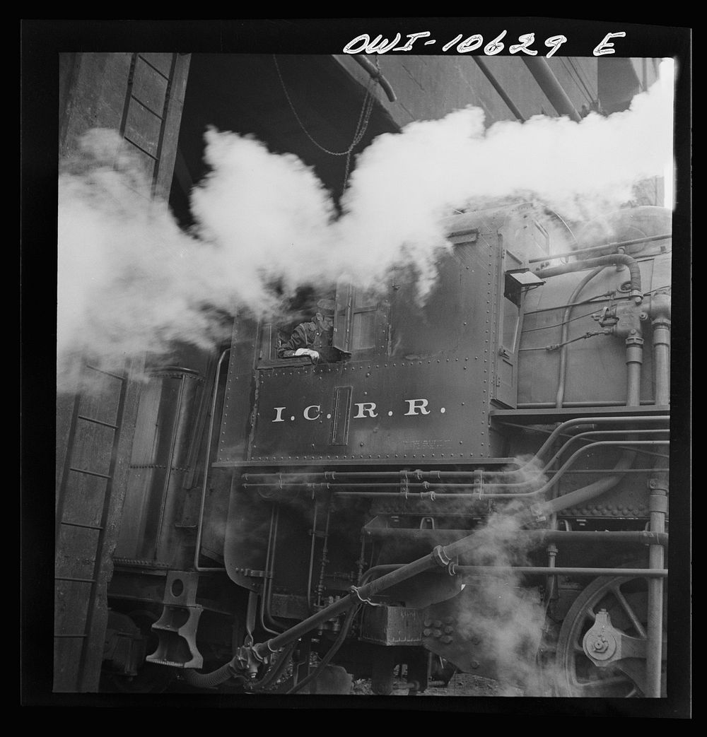 Chicago, Illinois. Locomotive picking up coal at an Illinois Central Railroad yard before going out on the road. Sourced…