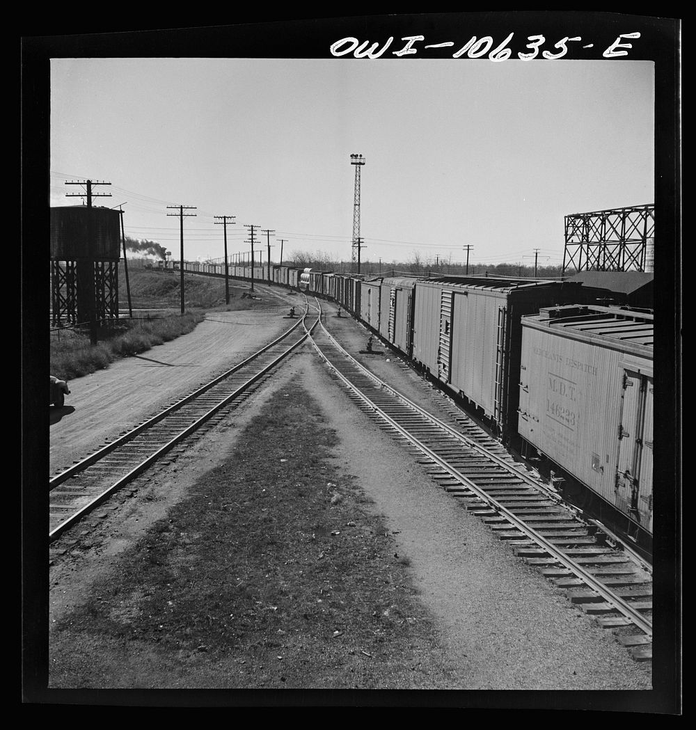 [Untitled photo, possibly related to: Chicago, Illinois. Freight train bound for New Orleans leaving an Illinois Central…