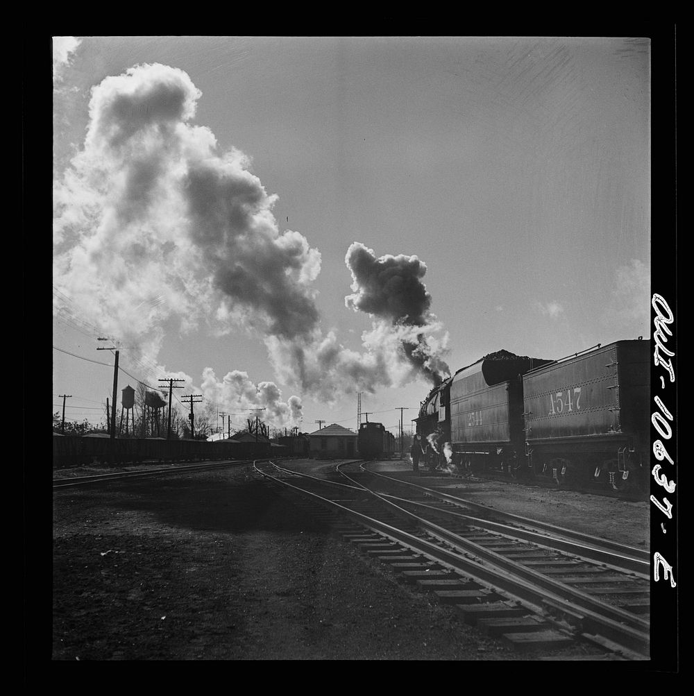 [Untitled photo, possibly related to: Chicago, Illinois. Southbound freight train leaving an Illinois Central Railroad…