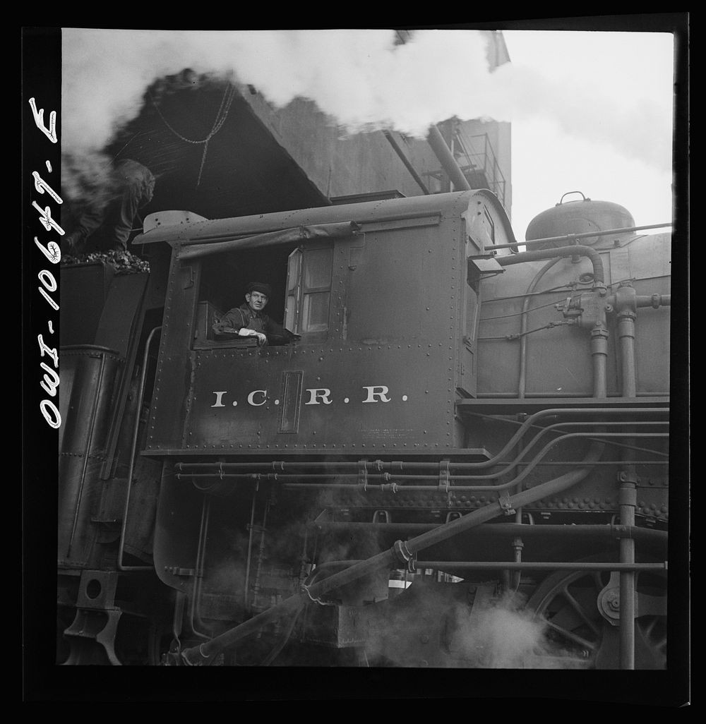[Untitled photo, possibly related to: Chicago, Illinois. Engine taking on coal at an Illinois Central Railroad yard].…
