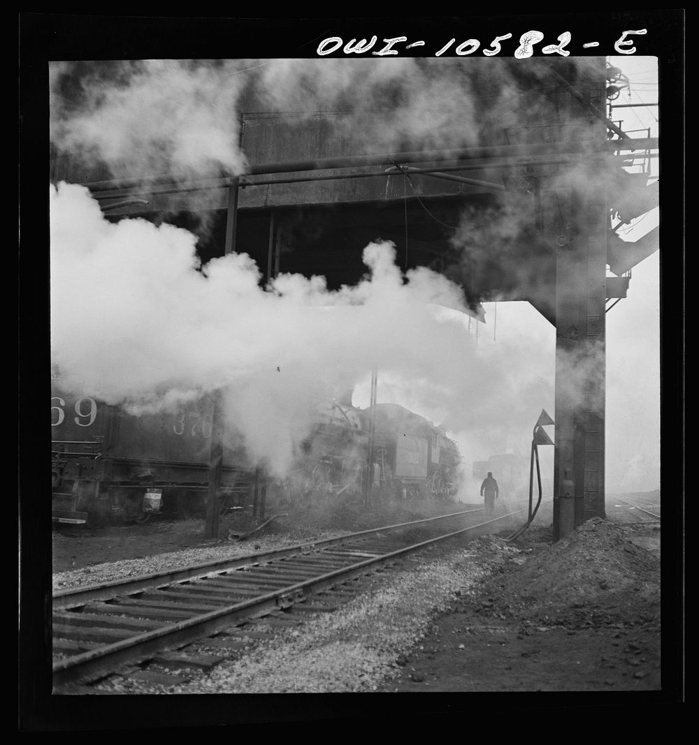 Chicago, Illinois. Locomotives loading up with coal, water, and sand at an Illinois Central Railroad yard before going out…