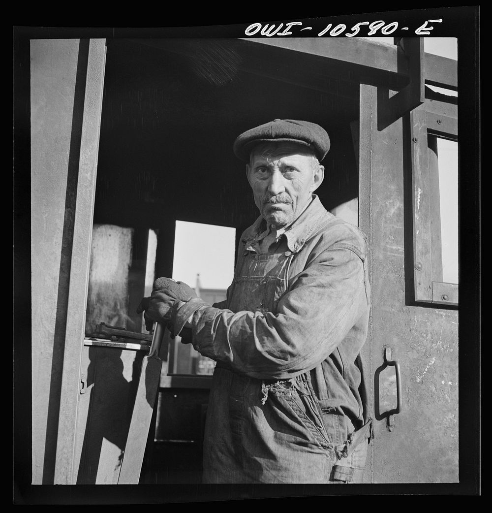 Chicago, Illinois. Turntable operator at the roundhouse at an Illinois Central Railroad yard. Sourced from the Library of…