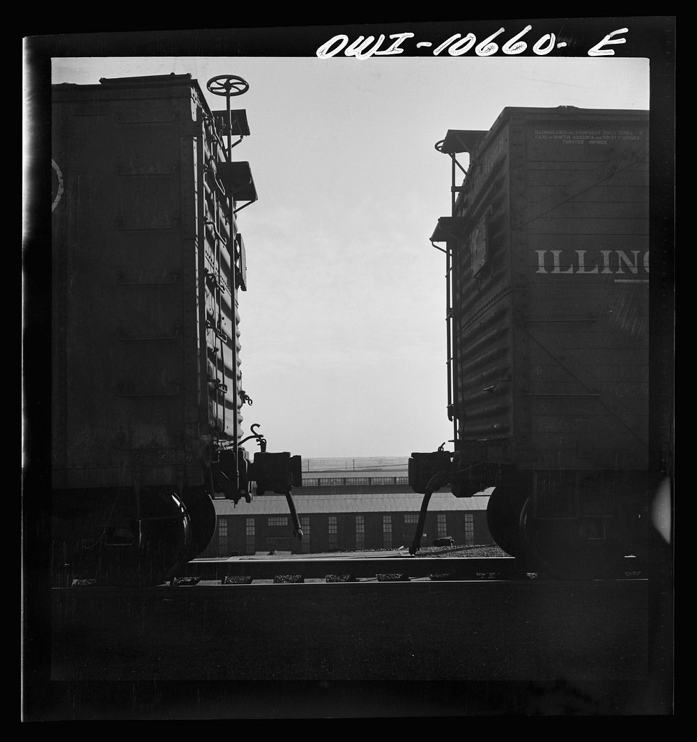 [Untitled photo, possibly related to: Chicago, Illinois. Cars are uncoupled at the top of the hump and roll down by gravity…