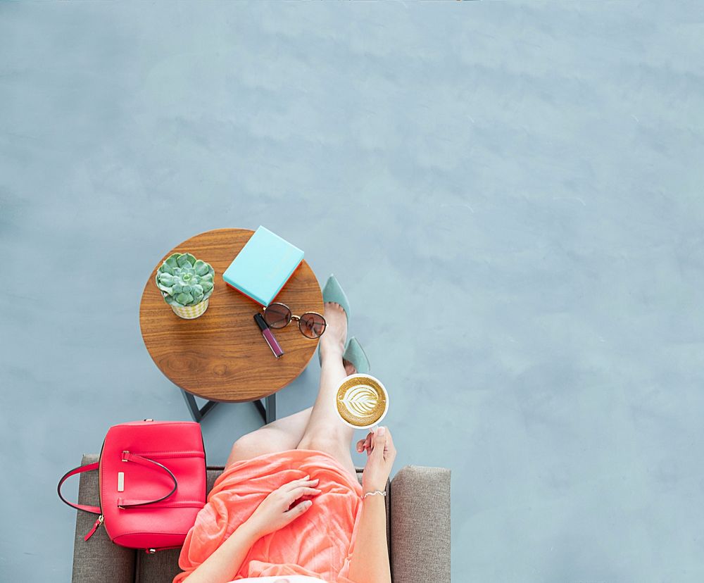 Free woman holding a cup of coffee image, public domain lifestyle CC0 photo.