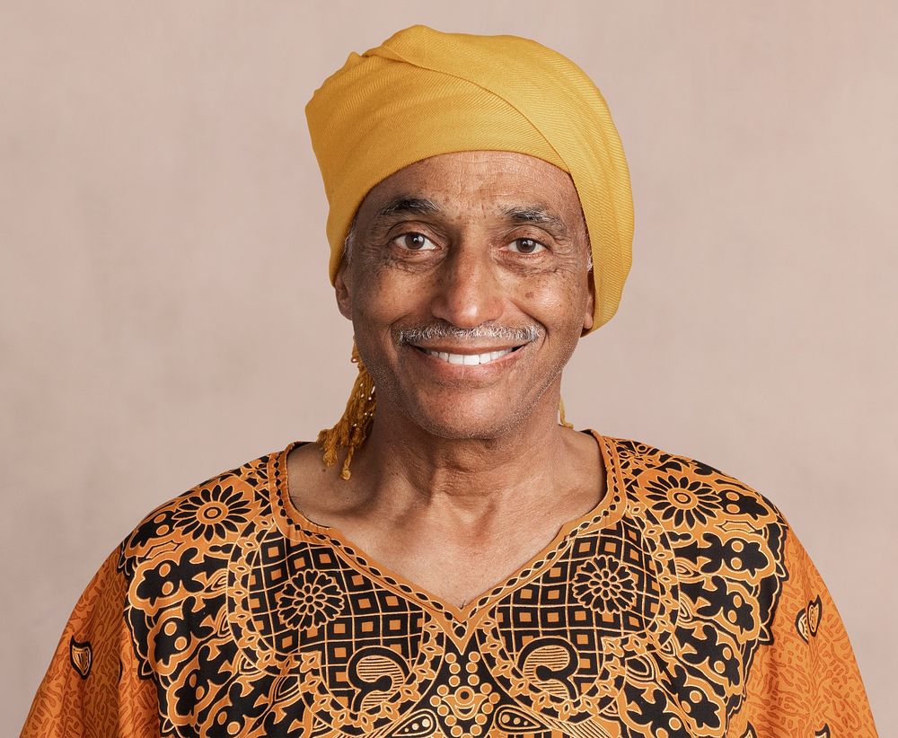 Happy mixed Indian senior man wearing a yellow turban mockup